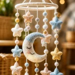Crochet baby mobile featuring charming stars and moons pattern for nursery decor